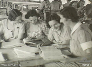 Members of the Australian Army Nursing Service (AANS) in Manila, after release from internment at Yokohama, at a prisoner of war (POW) processing unit on their way home.