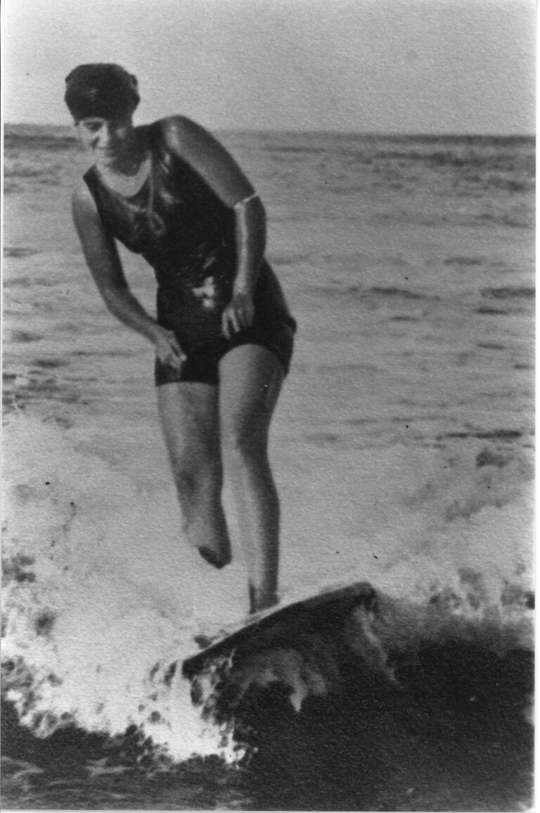 Surfboard riding, weight of board 56lbs.