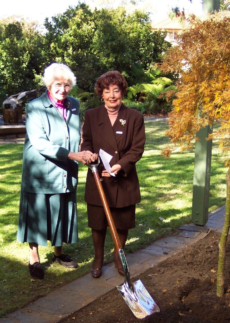 Planting a Japanese maple, gift of Ladies Drawing Room to University House in its Jubilee Year 2004